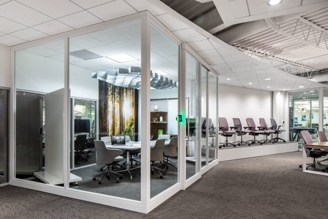 Architectural glass wall installation in a modern commercial office by FSN installation professionals.